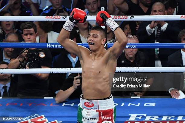 Jaime Munguia celebrates his fifth-round TKO against Brandon Cook during their WBO junior middleweight title fight at T-Mobile Arena on September 15,...