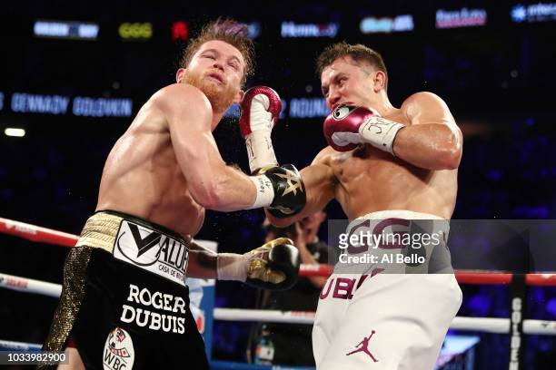 Gennady Golovkin punches Canelo Alvarez during their WBC/WBA middleweight title fight at T-Mobile Arena on September 15, 2018 in Las Vegas, Nevada.