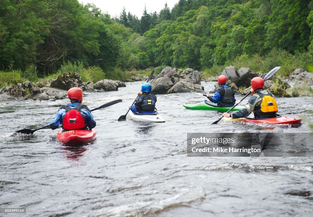 Four people kayaking