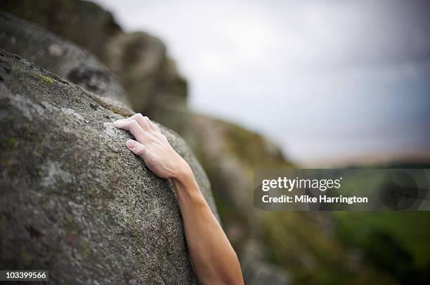 male climbing mountain face - challenger stock pictures, royalty-free photos & images