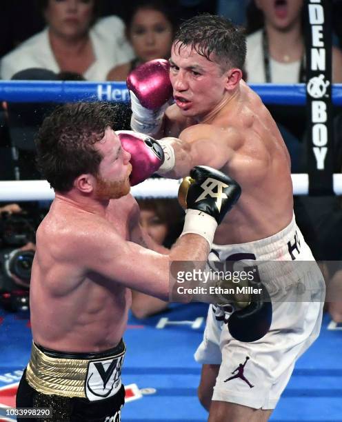 Gennady Golovkin throws a left at Canelo Alvarez in the 12th round of their WBC/WBA middleweight title fight at T-Mobile Arena on September 15, 2018...