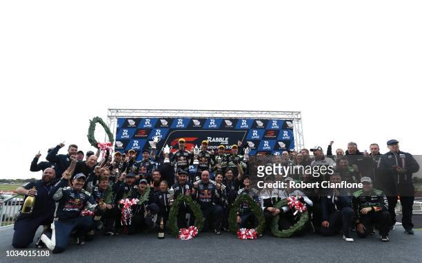 The Triple Eight Team celebrate their one, two and three finish in the Sandown 500 at Sandown International Motor Raceway on September 16, 2018 in...