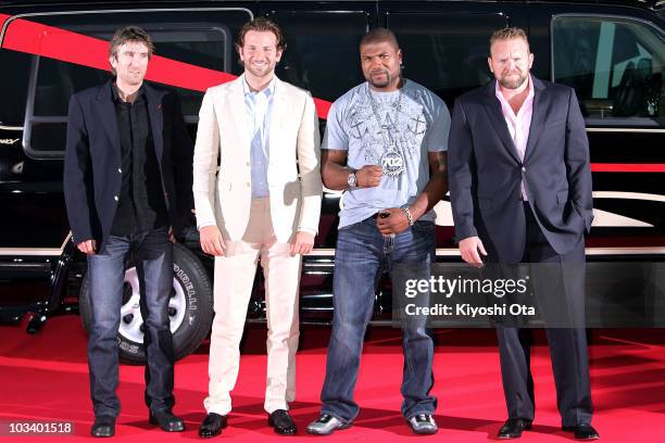 Actors Sharlto Copley, Bradley Cooper, Quinton 'Rampage' Jackson and director Joe Carnahan pose on the red carpet during the Japan Premiere of 'The...