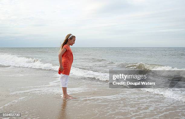 girl at beach. - ankle deep in water bildbanksfoton och bilder