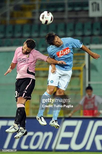 Antonio Nocerino of Palermo and Christian Maggio of Napoli compete for a header during the match Palermo vs. Napoli during the pre season friendly...