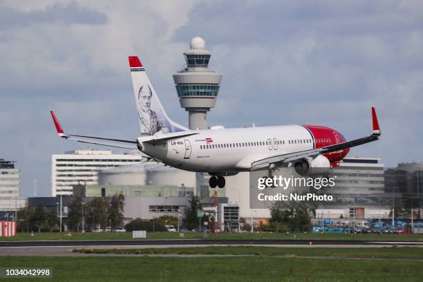 Norwegian Air Shuttle Boeing 737-800 landing at Amsterdam Schiphol International Airport, the Netherlands. Norwegian is a low cost carrier airline...