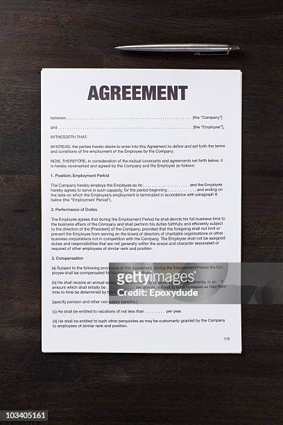 an employment agreement and a pen - contract stock pictures, royalty-free photos & images