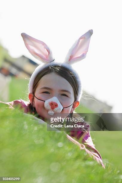a girl wearing rabbit ears and a mask - rabbit mask stock pictures, royalty-free photos & images