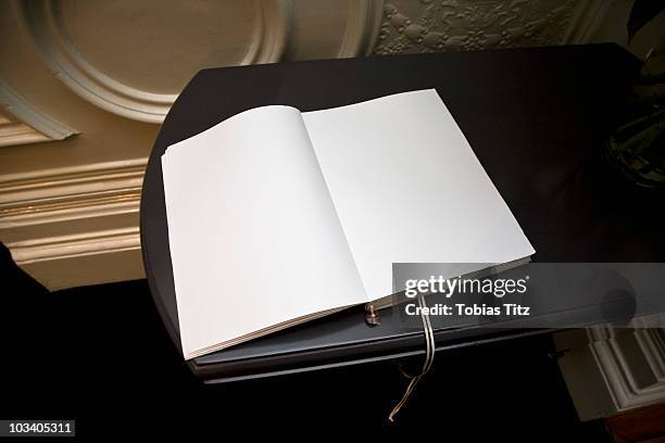 an open blank guest book - guest book stock pictures, royalty-free photos & images