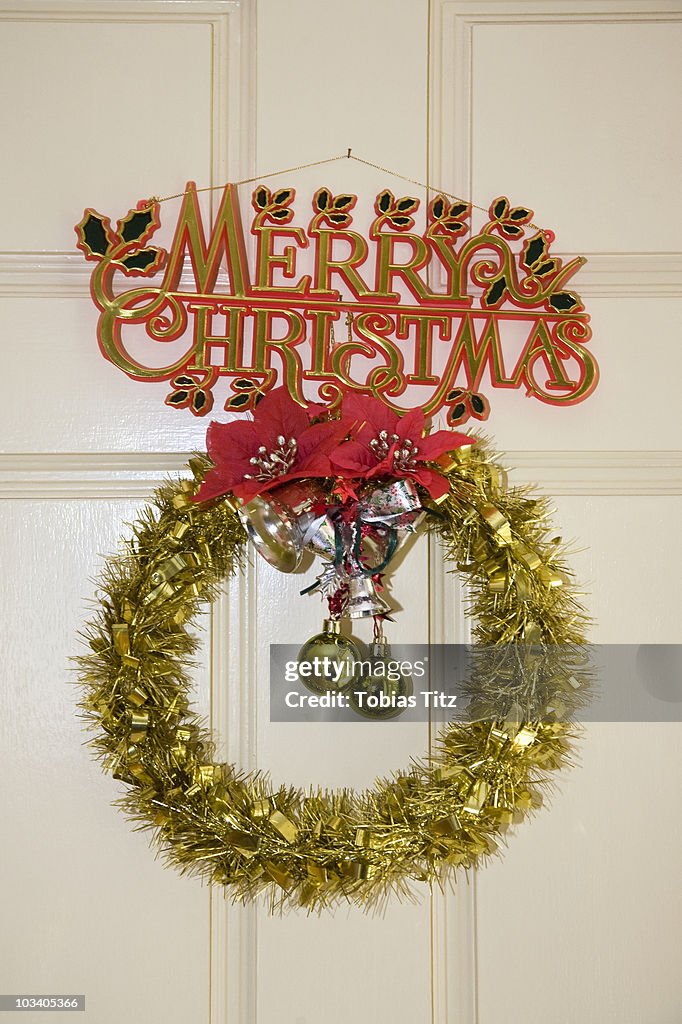 Detail of Christmas decorations hanging on a door