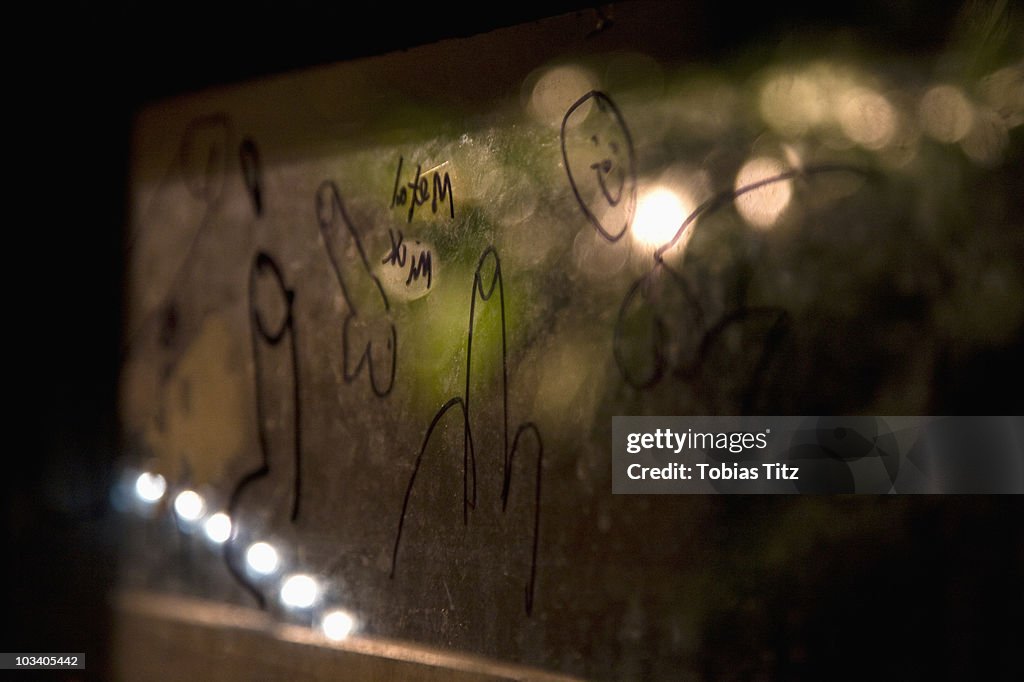 Graffiti on a reflective surface