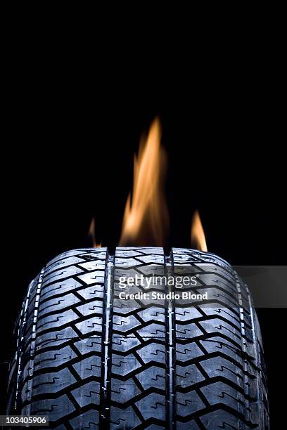detail of a tire on fire - burning rubber stock pictures, royalty-free photos & images