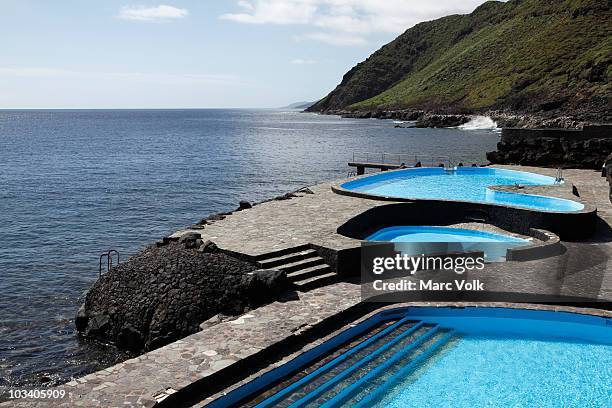 swimming pools next to the sea - hierro stock pictures, royalty-free photos & images