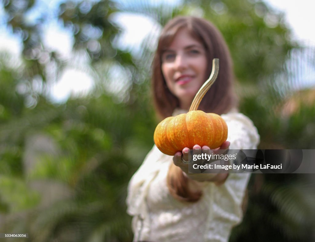Woman holding pumpkin