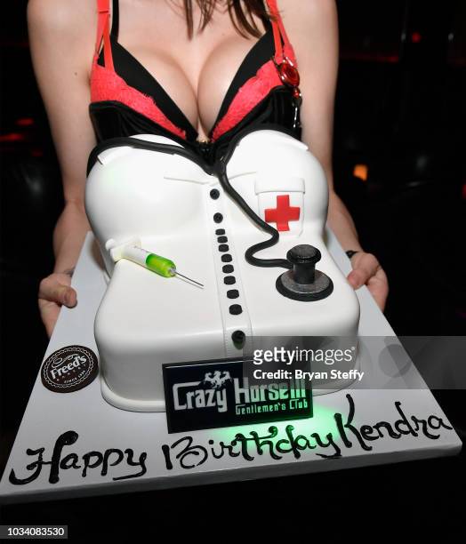 Adult film actress Kendra Lust's birthday cake is presented to her as she hosts her birthday party celebration at Crazy Horse 3 Gentlemen's Club on...
