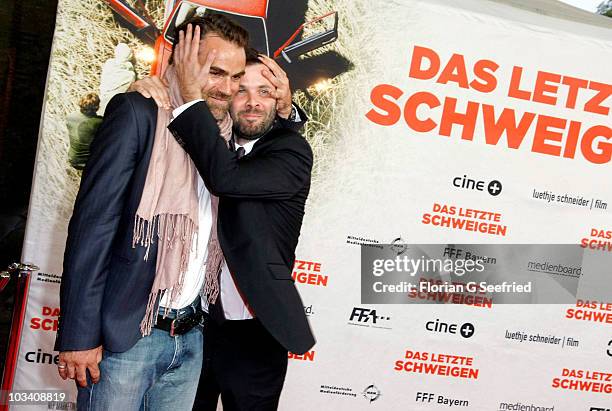 Actor Sebastian Blomberg and director Baron bo Odar attend the German Premiere of 'Das Letzte Schweigen' at cinema International on August 16, 2010...
