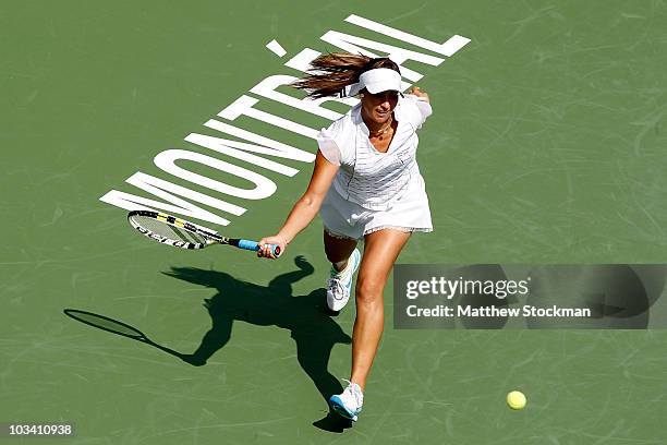 Aravane Rezai of France returns a shot to Petra Kvitova of the Czech Republic during the Rogers Cup at Stade Uniprix on August 16, 2010 in Montreal,...