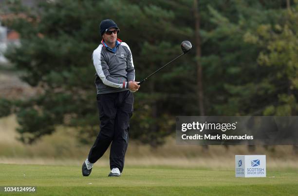 Paul Streeter of England plays his tee shot to the 4th hole during Day Three of the Scottish Senior Open at Craigielaw Golf Club on September 16,...