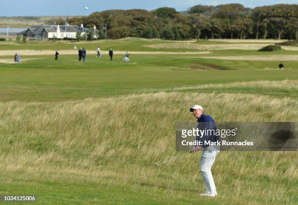 Gary Orr of Scotland plays his third shot to the 1st hole during Day Three of the Scottish Senior Open at Craigielaw Golf Club on September 16, 2018...