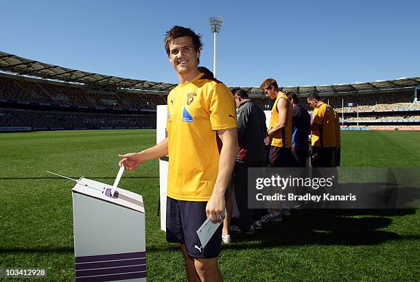 Jed Adcock of the Brisbane Lions casts his vote ahead of Saturday's Federal Election at The Gabba on August 17, 2010 in Brisbane, Australia. The...