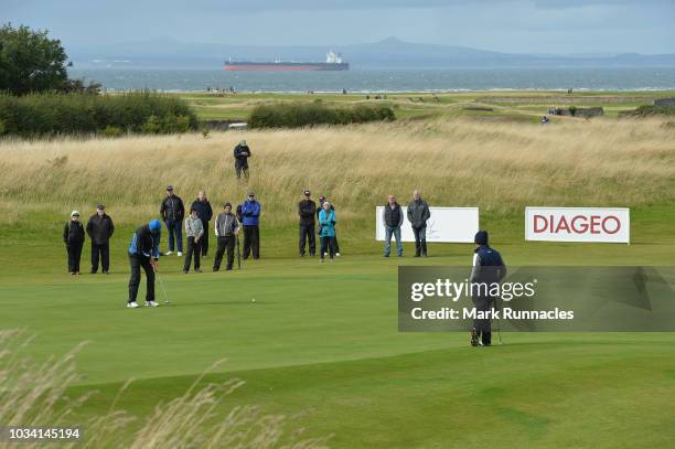 Gary Orr of Scotland, Paul Streeter of England and David Shacklady of England on the 9th green together during Day Three of the Scottish Senior Open...