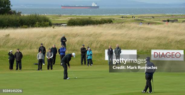 Gary Orr of Scotland, Paul Streeter of England and David Shacklady of England on the 9th green together during Day Three of the Scottish Senior Open...