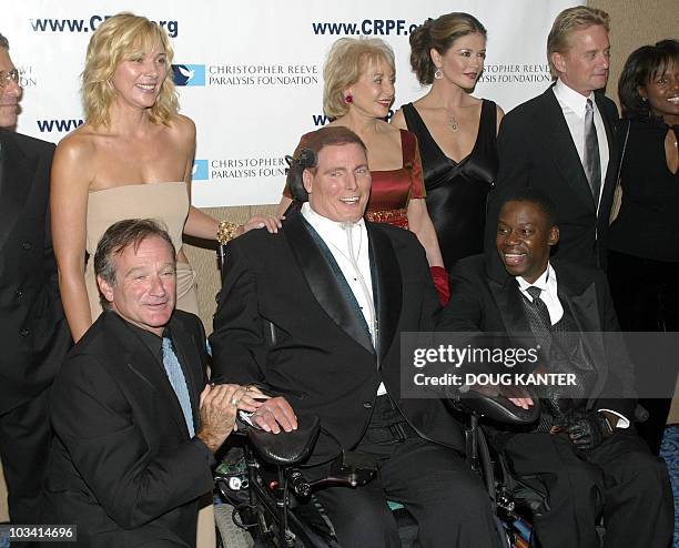 Christoper Reeve is surrounded by comedian Robin Williams actor Daryl Mitchell , actress Kim Cattrall , Barbara Walters , actress Catherine...