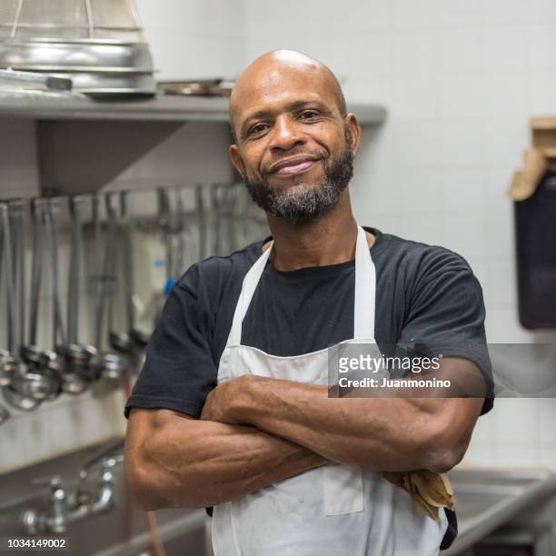 restaurant kitchen worker - chef male kitchen stock pictures, royalty-free photos & images