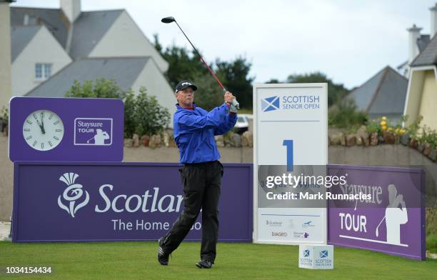 Gary Wolstenholme of England plays his tee shot to the 1st hole during Day Three of the Scottish Senior Open at Craigielaw Golf Club on September 16,...