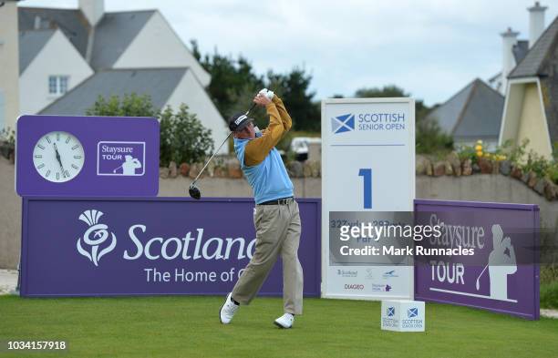 Mark Mouland of Wales plays his tee shot to the 1st hole during Day Three of the Scottish Senior Open at Craigielaw Golf Club on September 16, 2018...
