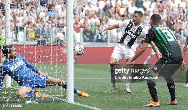 Cristiano Ronaldo of Juventus FC scores the opening goal during the serie A match between Juventus and US Sassuolo at Allianz Stadium on September...