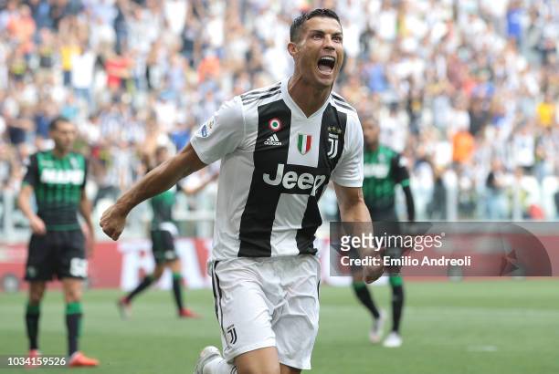 Cristiano Ronaldo of Juventus FC celebrates after scoring the opening goal during the serie A match between Juventus and US Sassuolo at Allianz...