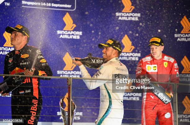 Top three finishers Lewis Hamilton of Great Britain and Mercedes GP , Max Verstappen of Netherlands and Red Bull Racing and Sebastian Vettel of...