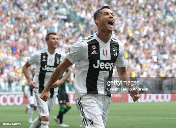 Cristiano Ronaldo of Juventus FC celebrates after scoring the opening goal during the serie A match between Juventus and US Sassuolo at Allianz...