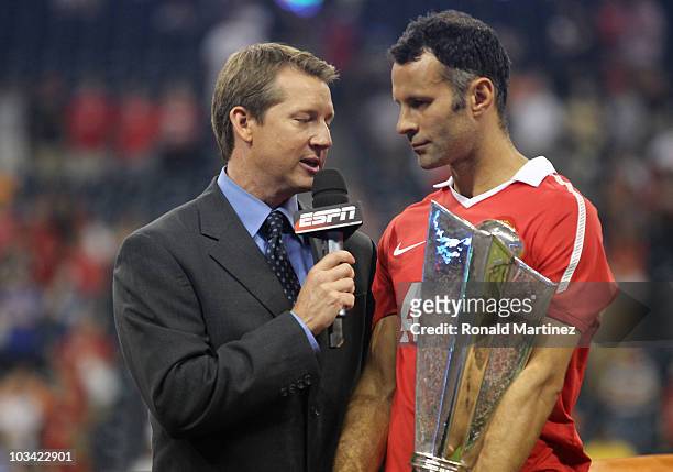 Ryan Giggs of Manchester United holds the All-Star trophy following United's 5-2 win over the MLS All-Stars in the MLS All Star Game at Reliant...