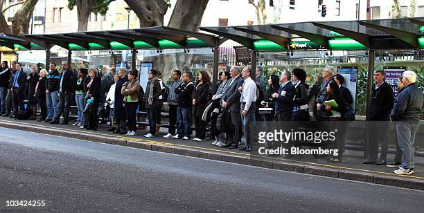 Commuters wait for a bus during rush hour in Sydney, Australia, on Monday, Aug. 16, 2010. Sydney's transportation woes have come to underscore the...