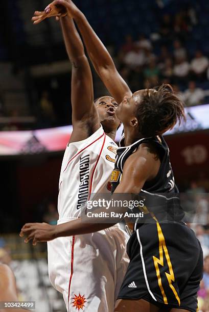 Tina Charles of the Connecticut Sun shoots over Amber Holt of the Tulsa Shock during the game on August 17, 2010 at Mohegan Sun Arena in Uncasville,...