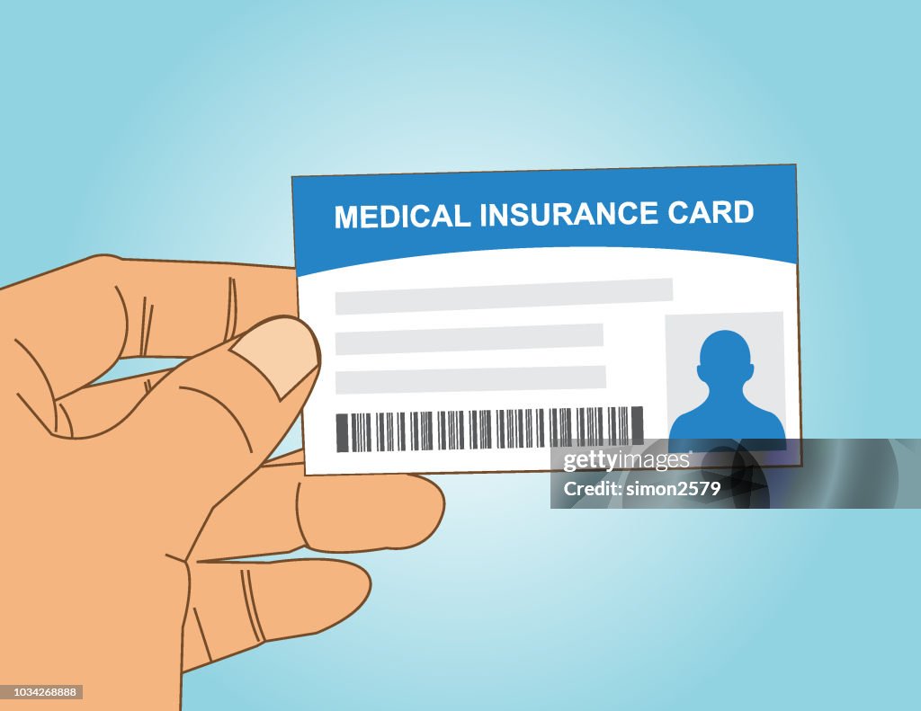 Hand holding medical insurance card