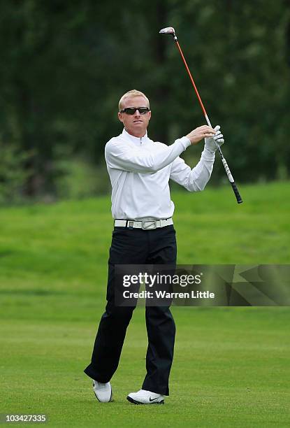 Simon Dyson of England plays his second shot into the seventh green during the Pro-Am of the Czech Open 2010 at Prosper Golf Resort on August 18,...