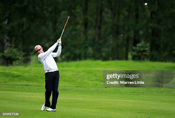 Simon Dyson of England plays his second shot into the seventh green during the Pro-Am of the Czech Open 2010 at Prosper Golf Resort on August 18,...