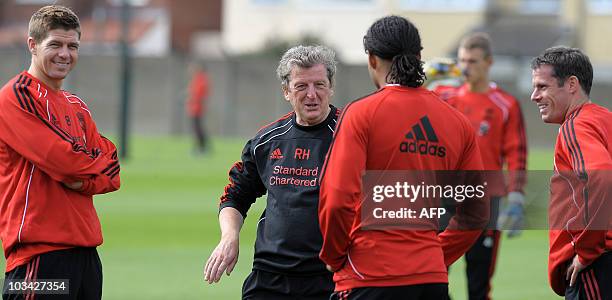 Liverpool Manager Roy Hodgson chats to Liverpool's English midfielder Steven Gerrard , Liverpool's English defender Jamie Carragher and Liverpool's...