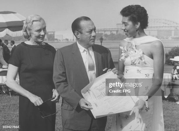 American tennis player Althea Gibson is honoured by Mayor Robert F. Wagner and his wife at Gracie Mansion in New York City in 1957.