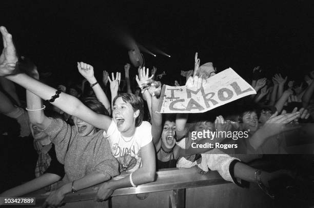 Screaming Duran Duran fans in the front row during a concert held at Wembley Arena in London, England on December 19, 1983.