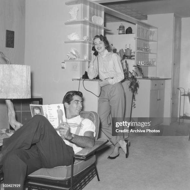 American actress Julie Adams at home with husband actor Ray Danton on October 17, 1955.