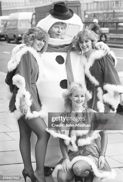 British comedian Benny Hill promotes his Thames Television Christmas special in London, England in December 1983.