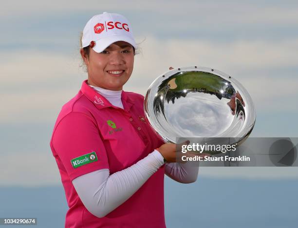 Ariya Jutanugarn of Thailand holds the Rolex Annika Major Award after the final round of The Evian Championship at Evian Resort Golf Club on...