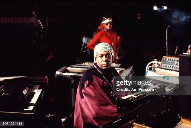 American keyboard player composer and orchestra leader Sun Ra performing at Berliner Jazz Tage, Berlin, Germany, November 1970. In the back, singer...