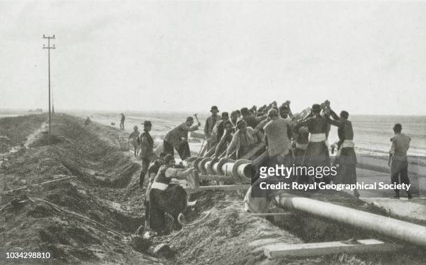 Laying pipe-line from the Persian oilfields to Abadan Refinery, Iran, circa 1928.