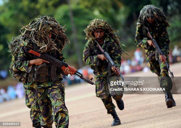Sri Lanka's first batch of Police Special Task Force women commandos perform a drill during a passing out parade at Katukurunda, some 40 kms south of...