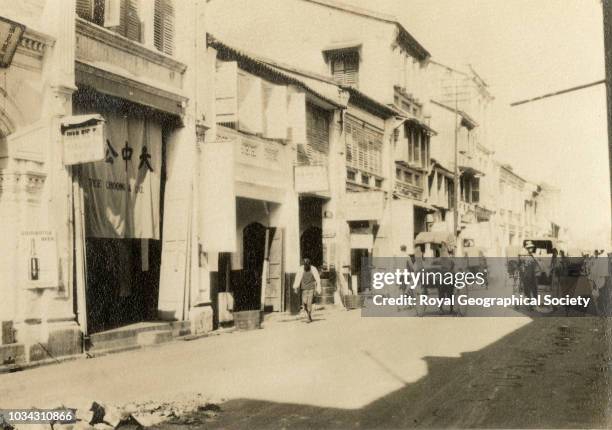 Chinese street at Penang, Malaysia, circa 1929.